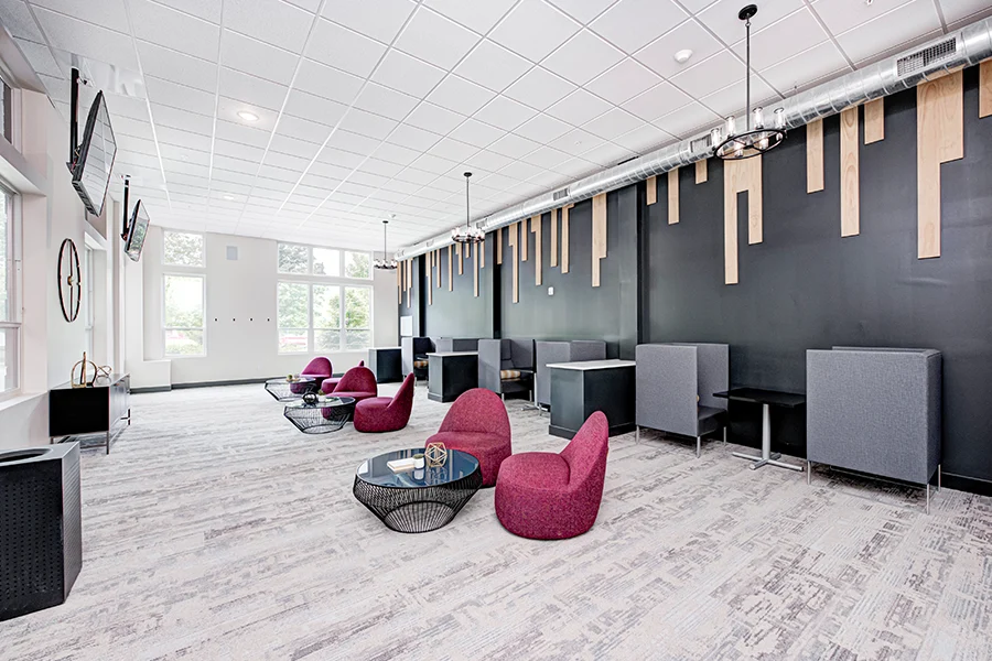 When you need a place to hang out, an apartment clubhouse like this one at Continuum Apartments is ideal. Long view of a trendy apartment clubhouse common room